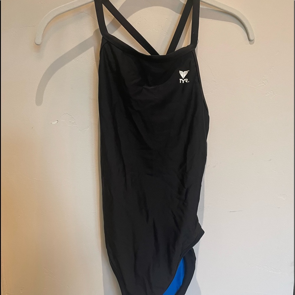 TYR swimsuit bathing suit. Compresses you and performs very well! Flattering!